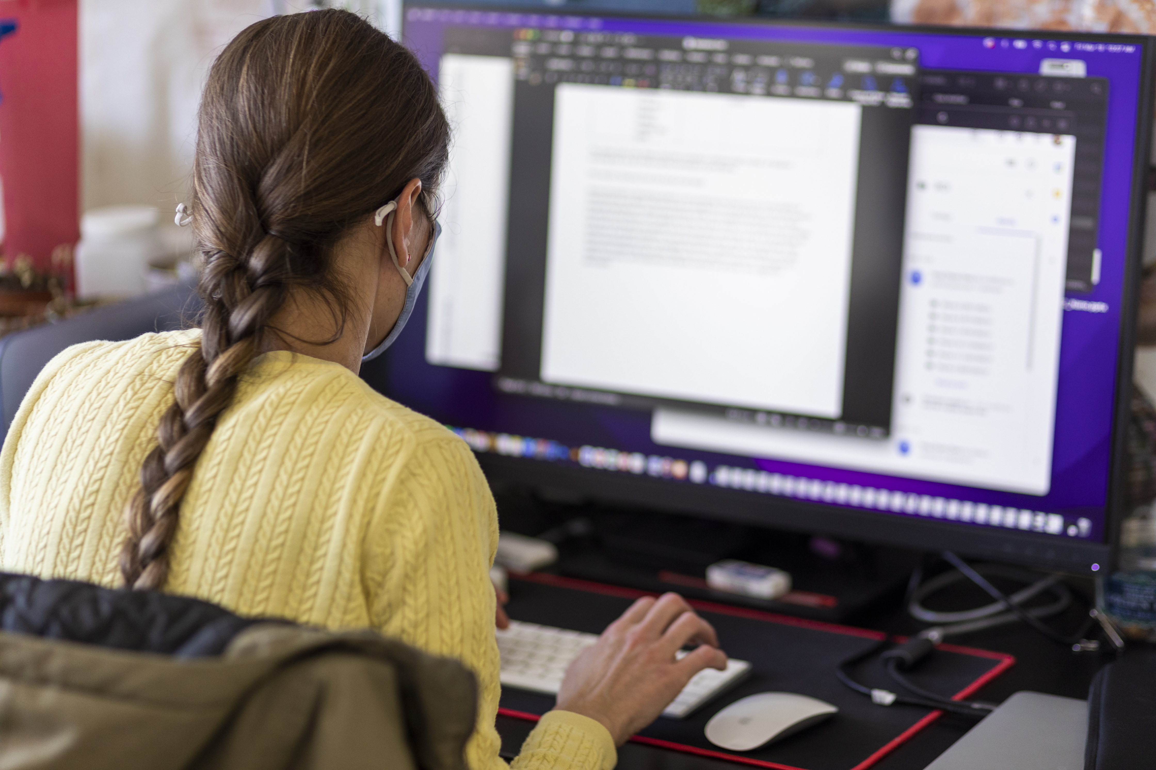 Image of woman looking at computer